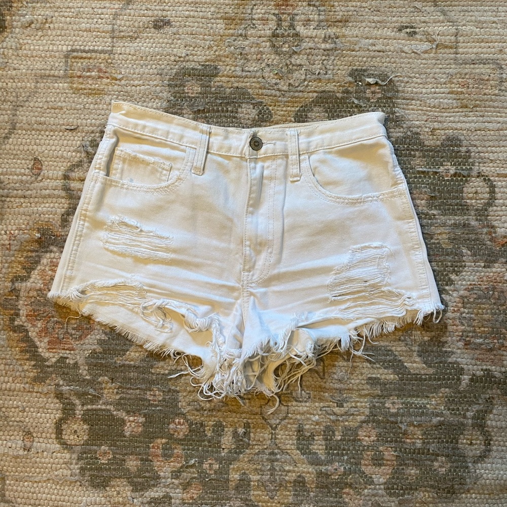 High waisted white distressed shorts